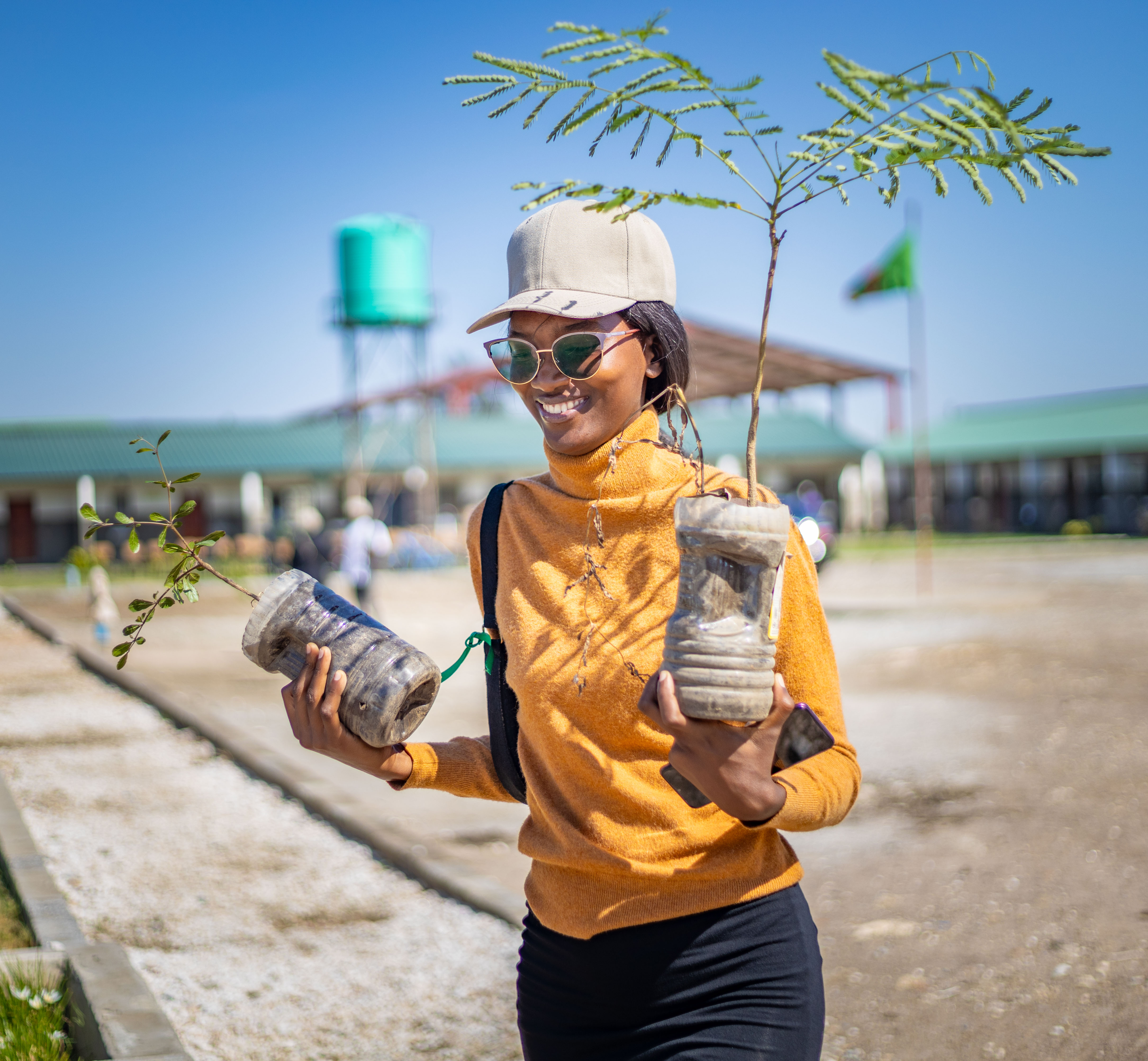 Community member holding seedlings